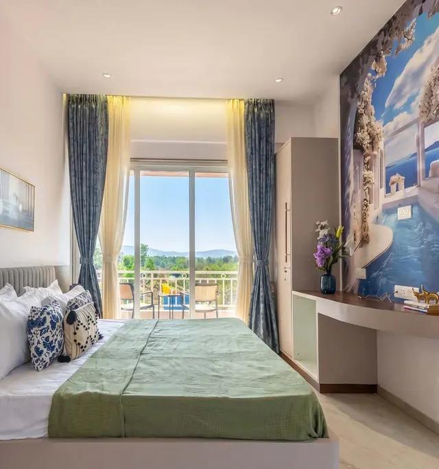 Master bedroom with balcony and hill view
