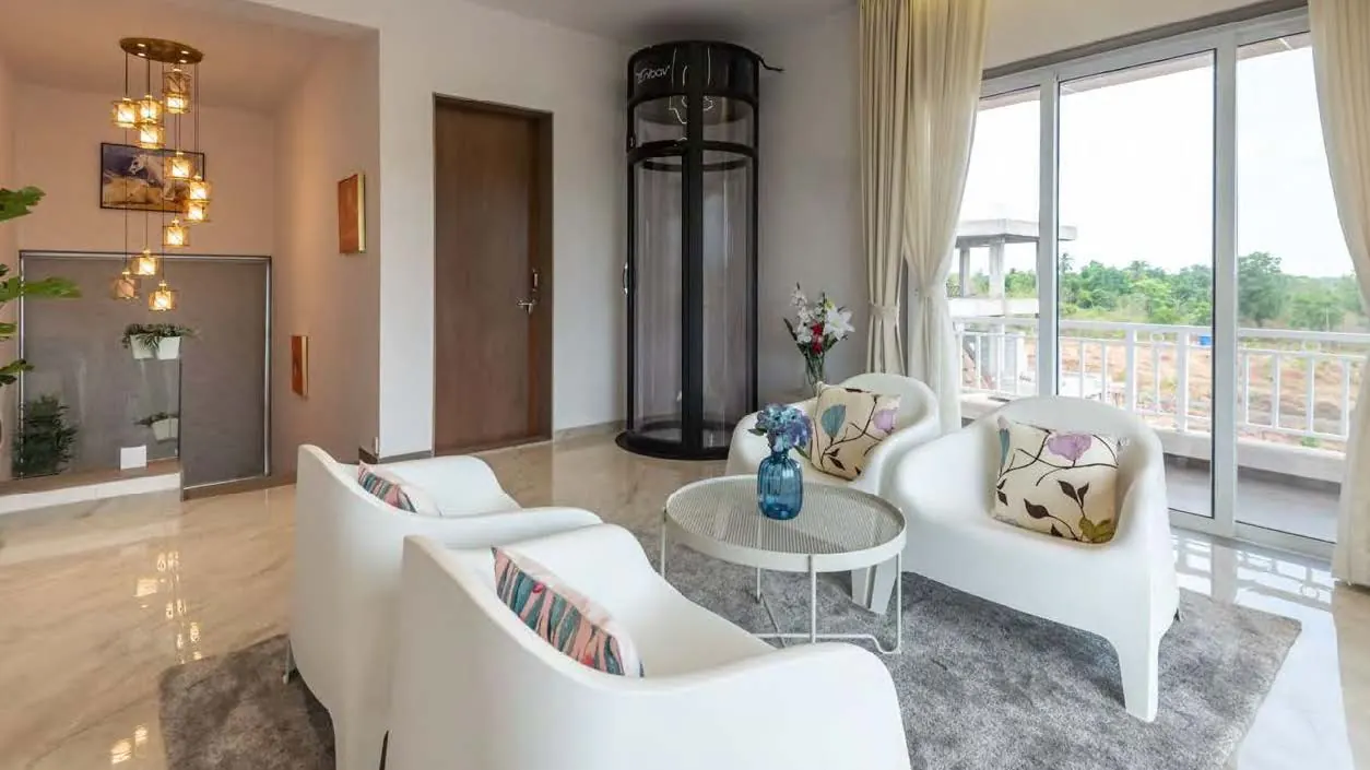 Living room with home lift and terrace access