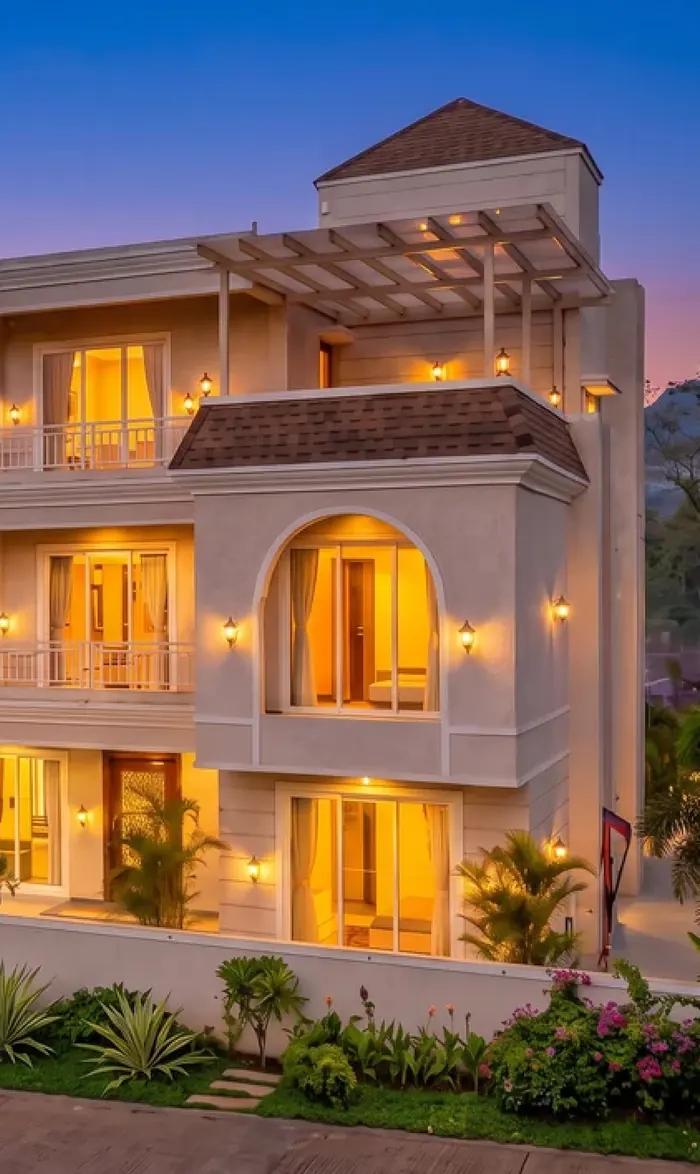 A Morning Star villa lit at dusk, three levels with the pitched tower above